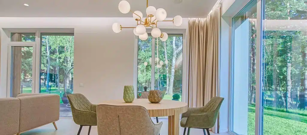 A close-up of a modern textile cleaning machine’s internal drum with wet cloths tumbling and streams of water visible